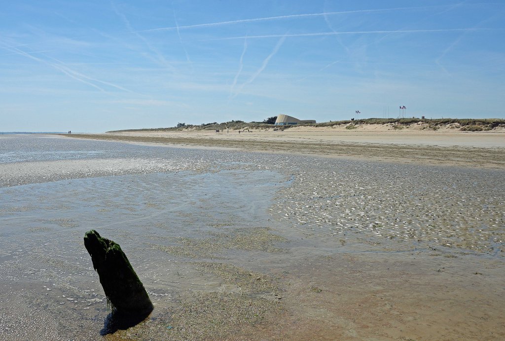 Utah Beach with the D-Day museum visible in the dunes in the background
